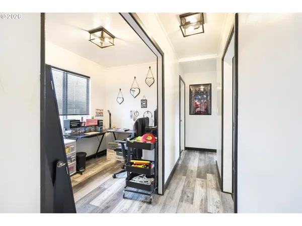 a view of living room with furniture and wooden floor