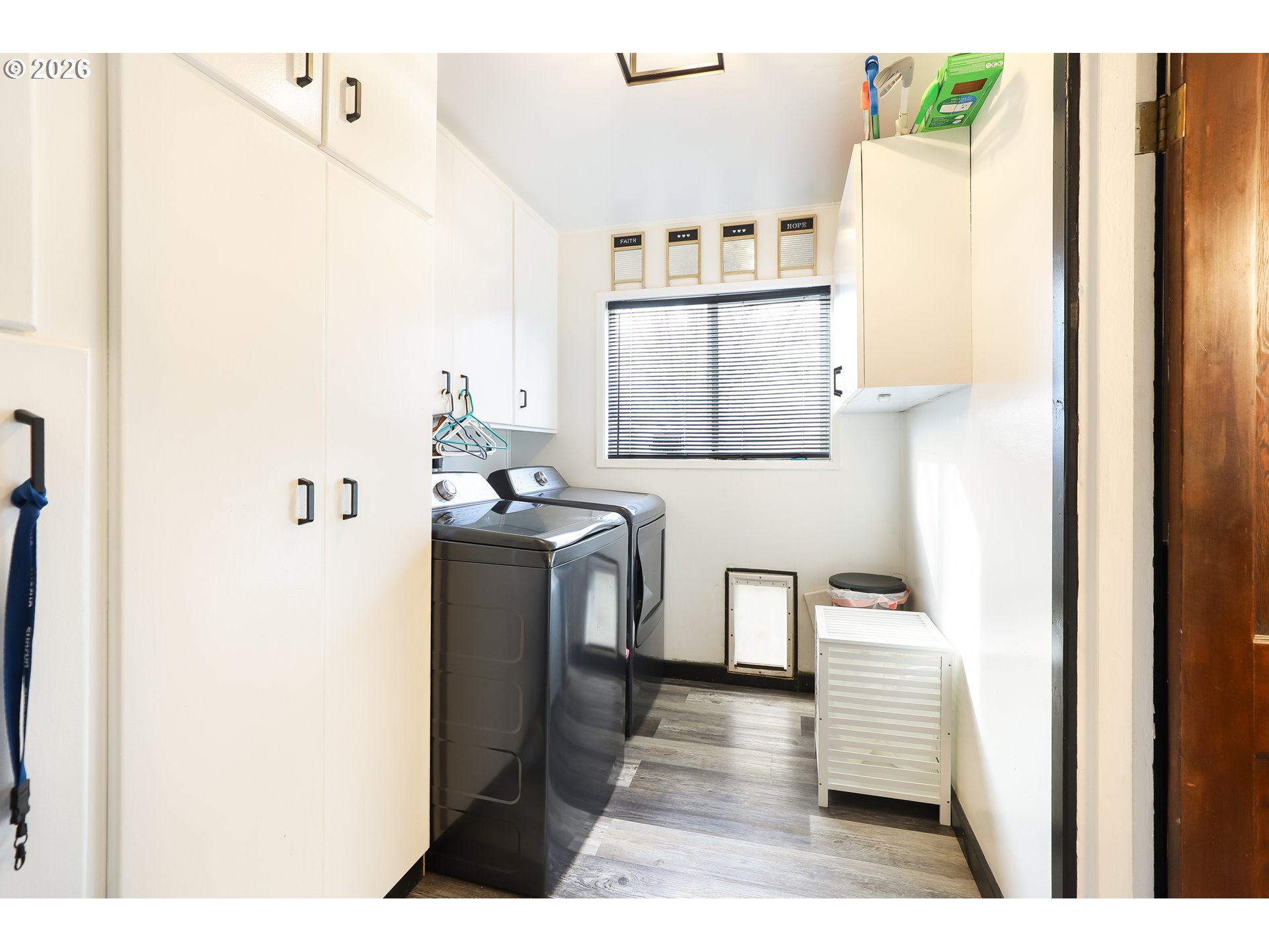 409 Northeast Court Street Dufur, OR 97021 - Photo 9 of 38 a utility room with cabinets washer and dryer