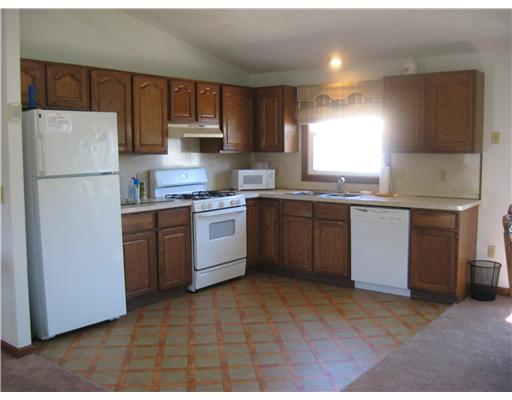 21 Sand Hill Cove Road Narragansett, RI 02882 - Photo 3 of 16 Kitchen. Open Kitchen/Dining area. Sliders to large deck.