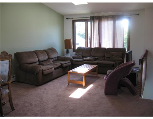 21 Sand Hill Cove Road Narragansett, RI 02882 - Photo 5 of 16 Living Room. Finished lower level family room. Sliders to large screened porch.