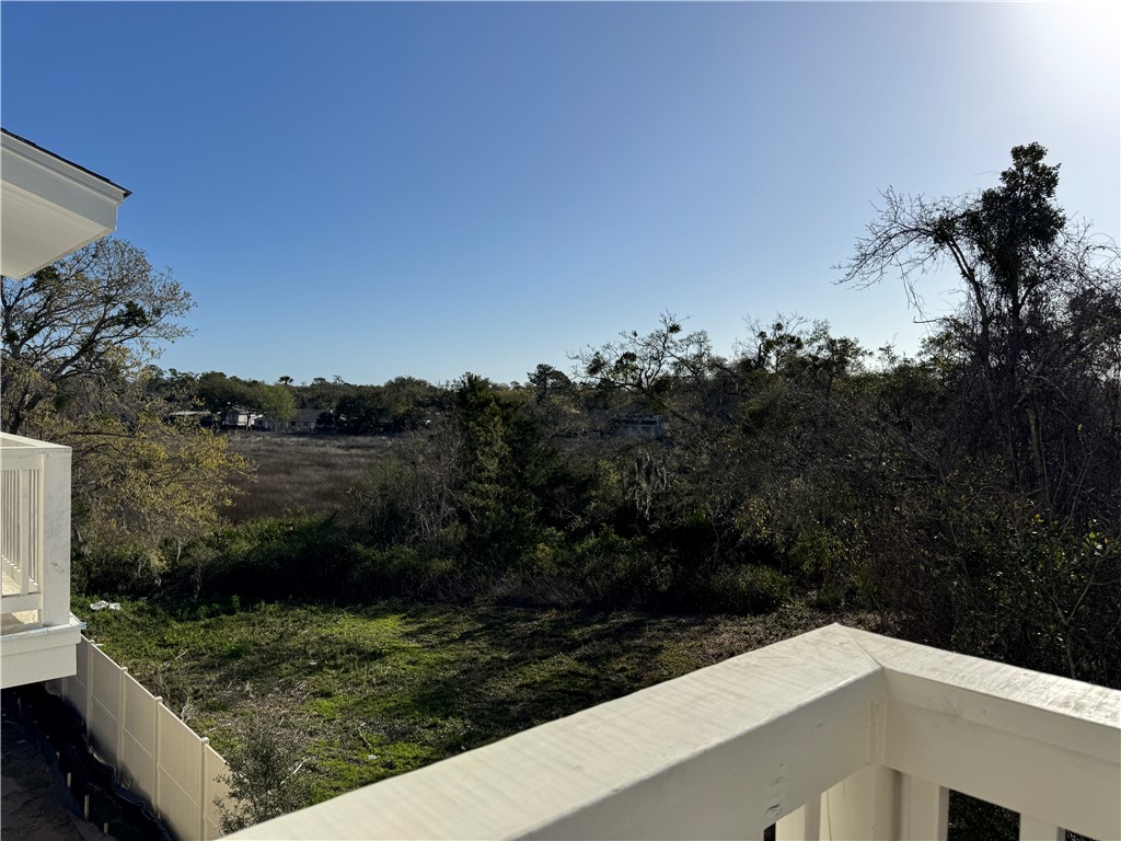 12 Moss Pointe Ln Street, Unit 4 St. Simons Island, GA 31522 - Photo 4 of 13 Back balcony view of the marsh
