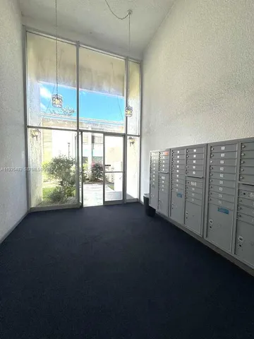 a view of a room with large windows