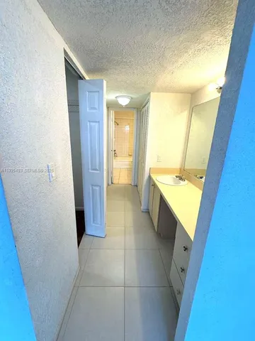 a bathroom with a sink a toilet and a tub