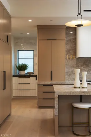 a view of dining table chairs and chandelier