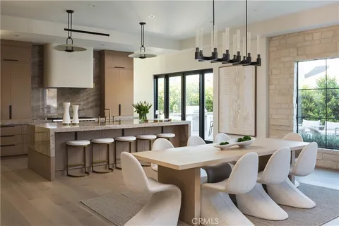 a living room with furniture a table and a large window