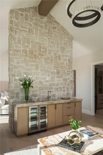 a large bedroom with a bed and glass windows