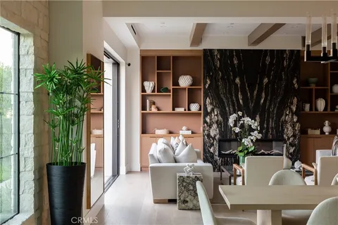 a dining room with furniture and wooden floor