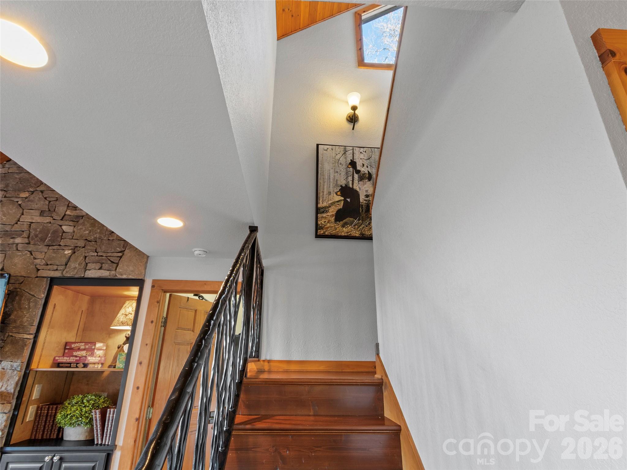 71 Ivy Ridge Road Burnsville, NC 28714 - Photo 14 of 23 a view of a hallway with wooden floor and staircase
