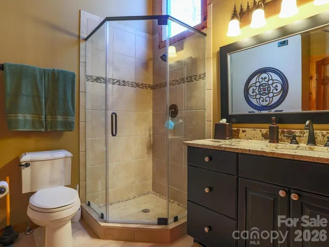 a bathroom with a toilet sink and shower