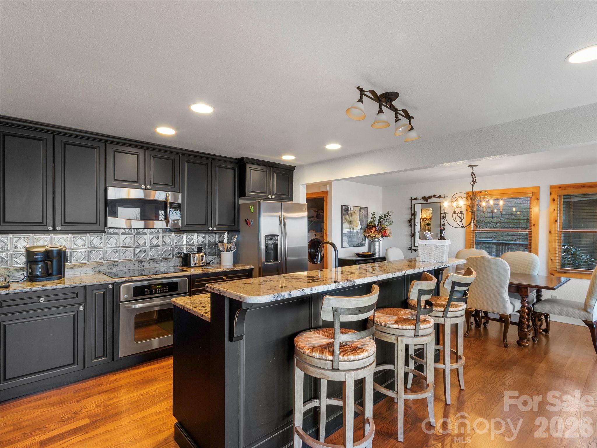 71 Ivy Ridge Road Burnsville, NC 28714 - Photo 6 of 23 a kitchen with a sink stove and cabinets