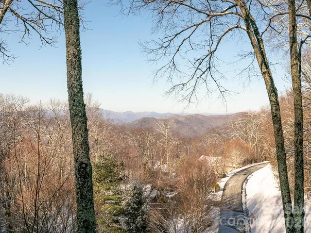 a view of mountain view with lots of trees