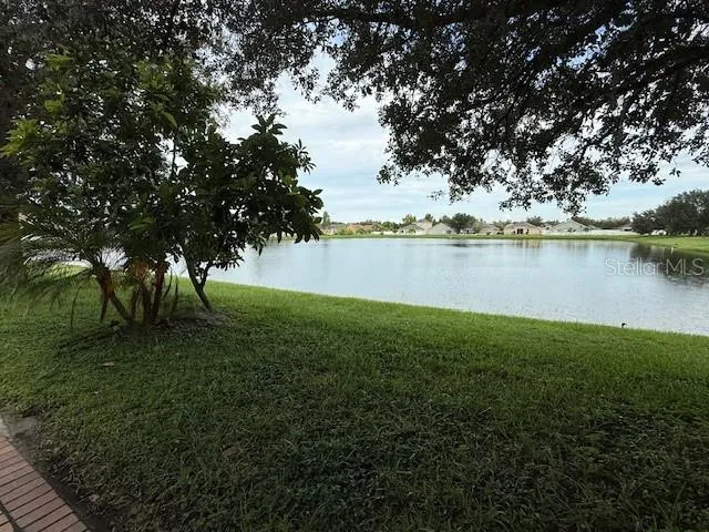 a view of a lake with houses in outdoor space