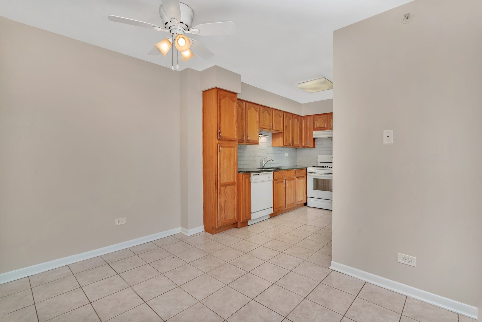 5724 West 111th Street, Unit 3A Chicago Ridge, IL 60415 - Photo 6 of 12 a view of kitchen with granite countertop cabinets and refrigerator