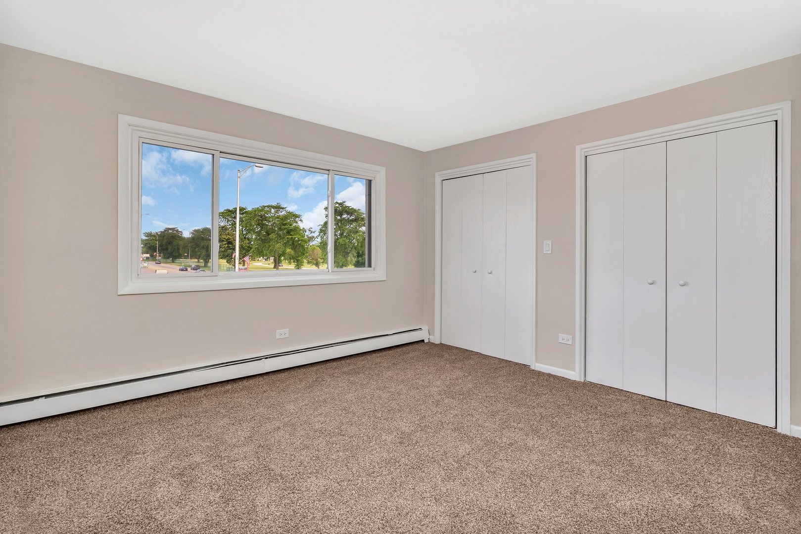 5724 West 111th Street, Unit 3A Chicago Ridge, IL 60415 - Photo 8 of 12 an empty room with windows