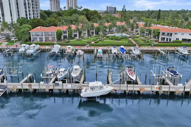 a view of a lake with a car park next to a brick building