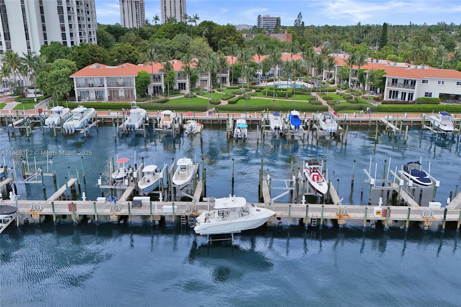 a view of a lake with a car park next to a brick building