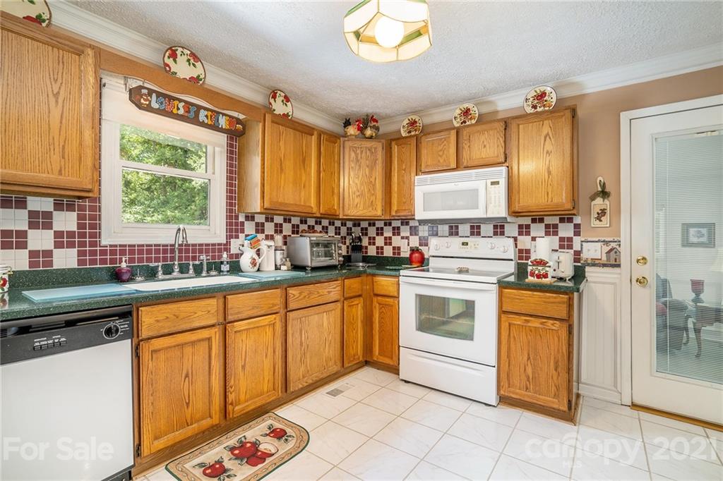 1251 Crossland Road Clover, SC 29710 - Photo 12 of 45 a kitchen with stainless steel appliances a stove a sink and a refrigerator