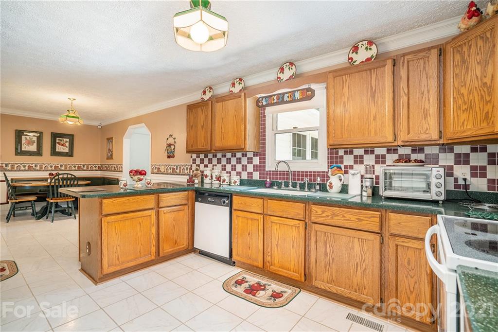 1251 Crossland Road Clover, SC 29710 - Photo 13 of 45 a kitchen with stainless steel appliances granite countertop a sink and cabinets