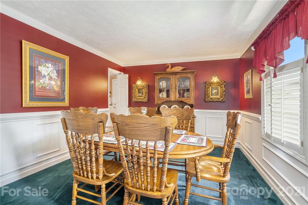 1251 Crossland Road Clover, SC 29710 - Photo 16 of 45 a view of a dining room with furniture and wooden floor