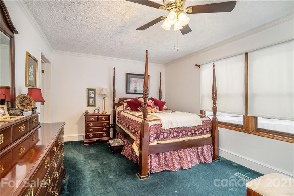 1251 Crossland Road Clover, SC 29710 - Photo 19 of 45 a bed room with a bed window and a ceiling fan