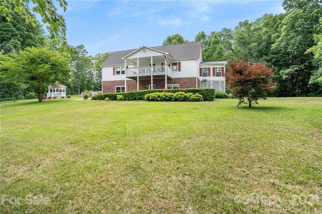 1251 Crossland Road Clover, SC 29710 - Photo 3 of 45 a front view of a house with a garden
