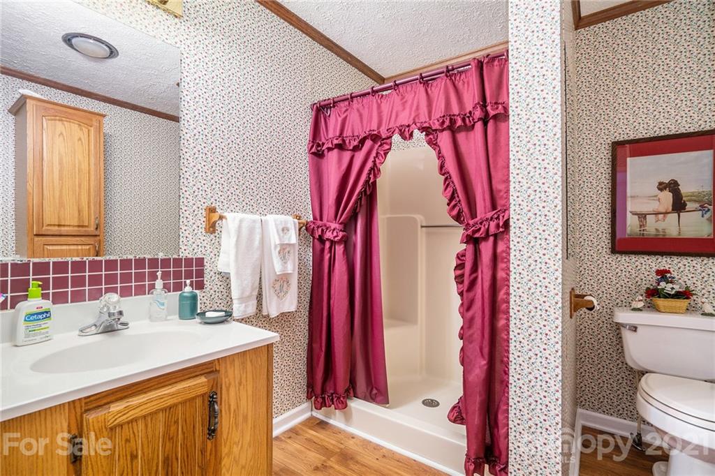 1251 Crossland Road Clover, SC 29710 - Photo 21 of 45 a bathroom with a sink toilet and shower