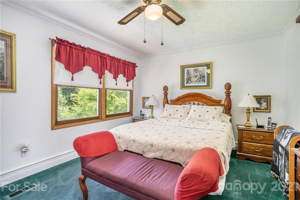 1251 Crossland Road Clover, SC 29710 - Photo 22 of 45 a bedroom with a bed and wooden floor