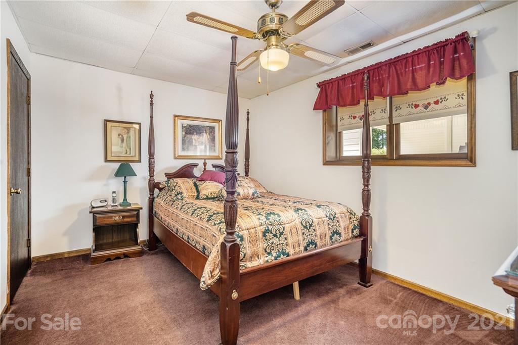 1251 Crossland Road Clover, SC 29710 - Photo 24 of 45 a bed sitting in a bedroom next to a window