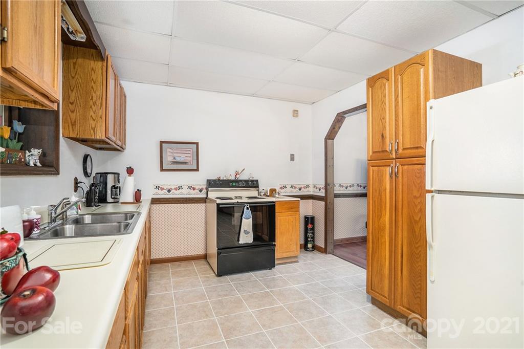 1251 Crossland Road Clover, SC 29710 - Photo 28 of 45 a kitchen with stainless steel appliances a stove a sink and a refrigerator