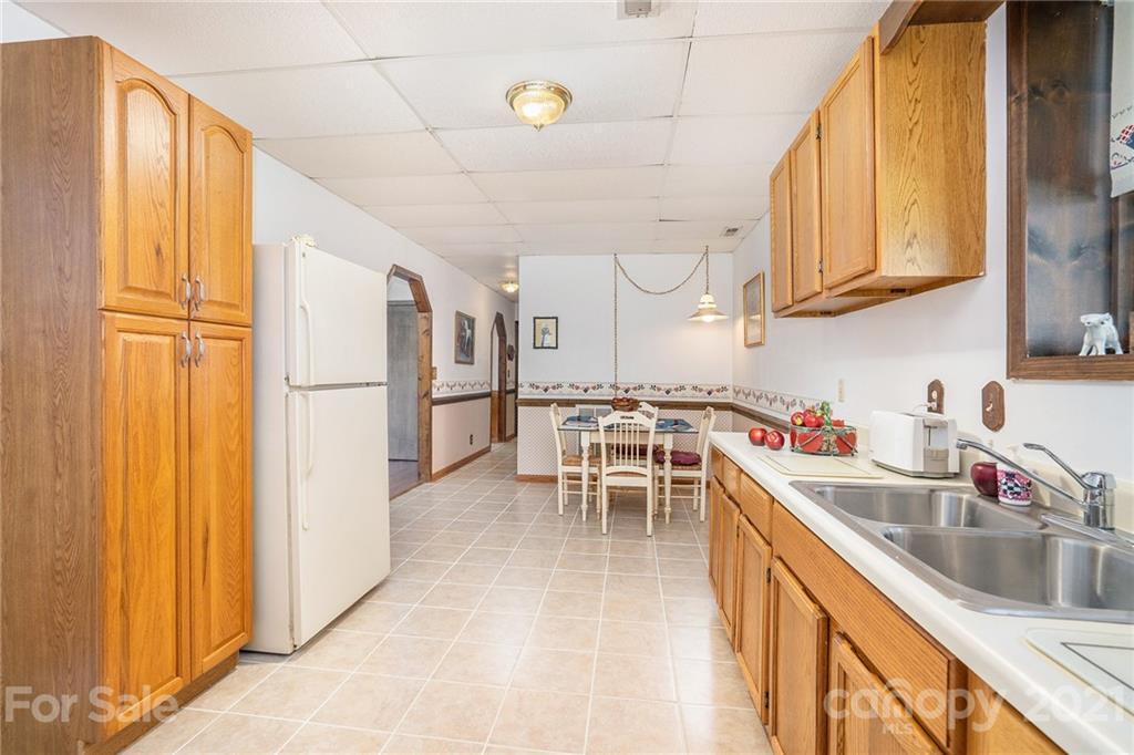 1251 Crossland Road Clover, SC 29710 - Photo 29 of 45 a kitchen with granite countertop a sink appliances cabinets and counter space