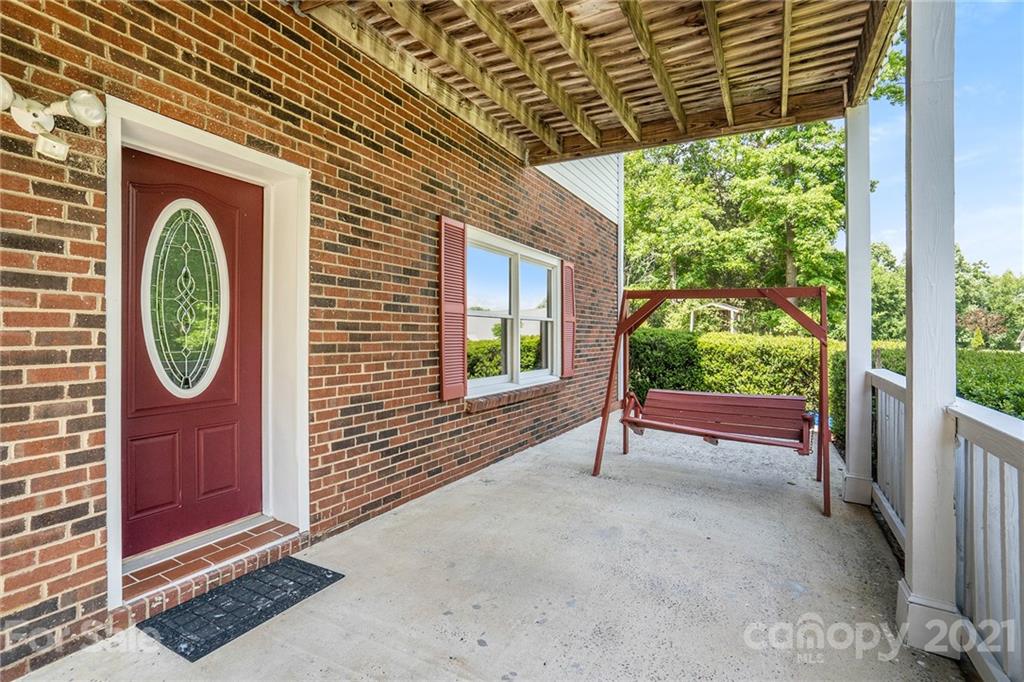 1251 Crossland Road Clover, SC 29710 - Photo 4 of 45 a view of a house with a large window and wooden fence
