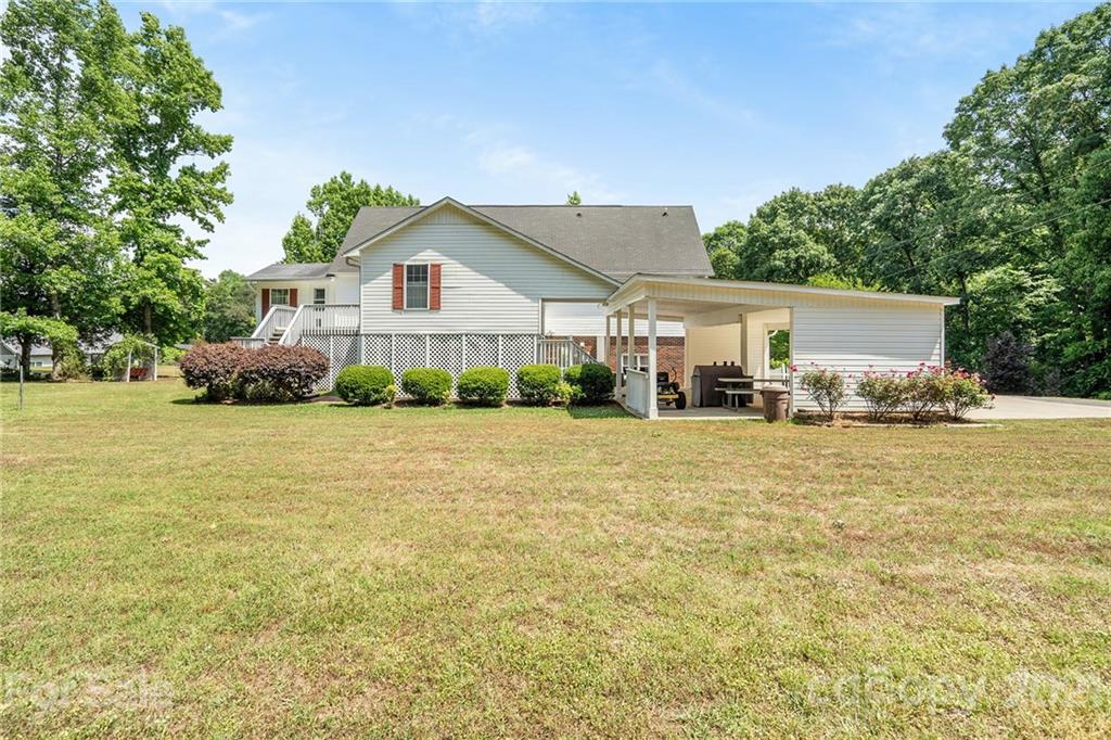 1251 Crossland Road Clover, SC 29710 - Photo 42 of 45 a front view of house with yard and trees in the background