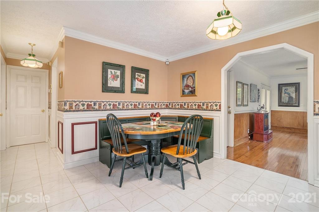 1251 Crossland Road Clover, SC 29710 - Photo 10 of 45 a view of a dining room with furniture and chandelier