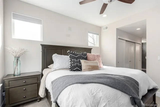 a bedroom with a bed and window