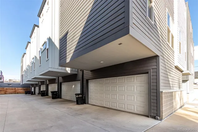 a view of a building with parking space