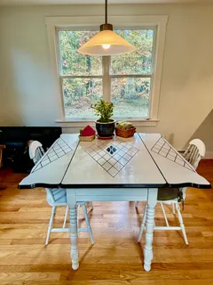 a view of a dining room with furniture window and outside view