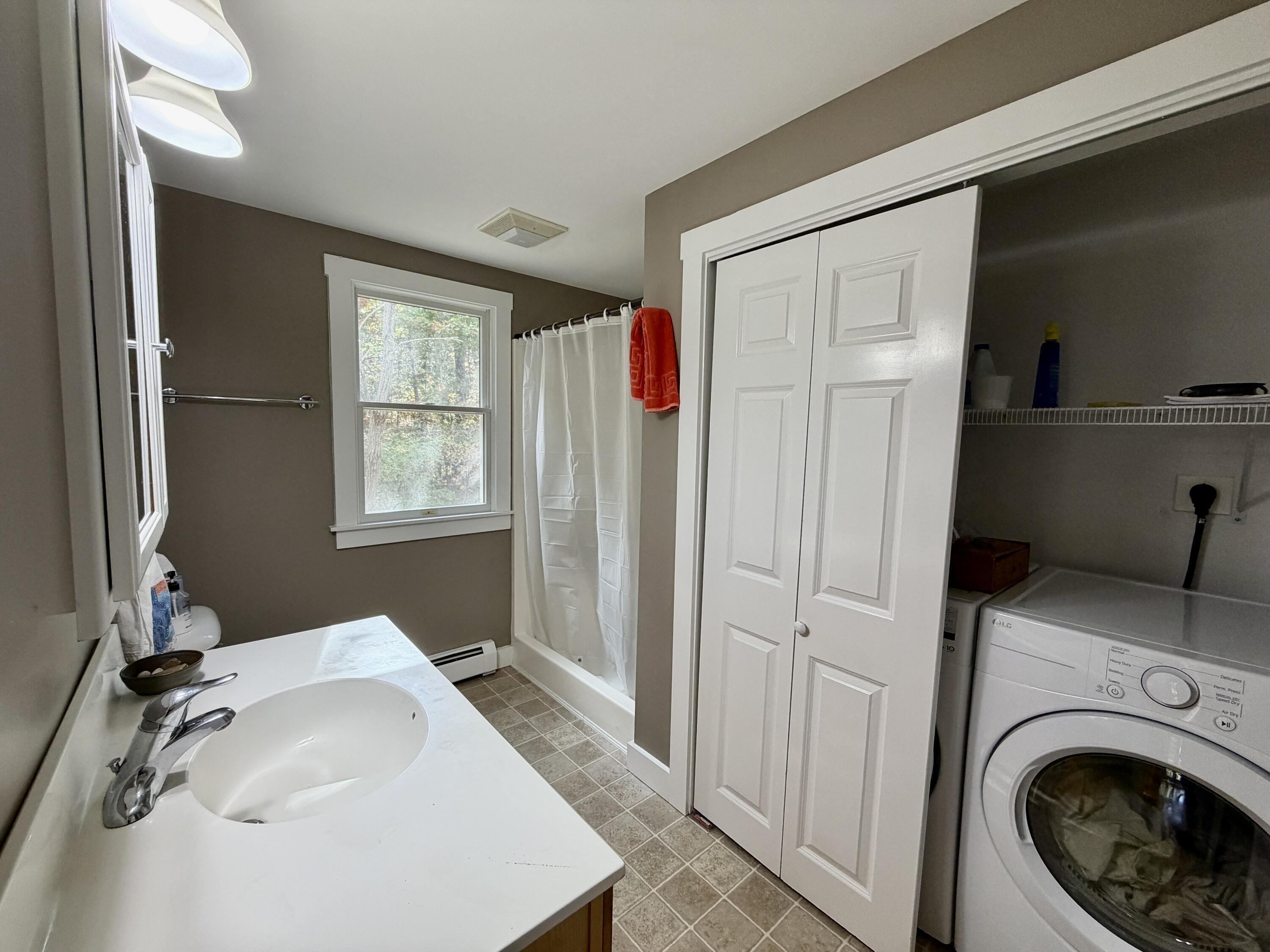 46 Spring Brook Road Wellfleet, MA 02667 - Photo 13 of 37 a bathroom with a sink and a mirror