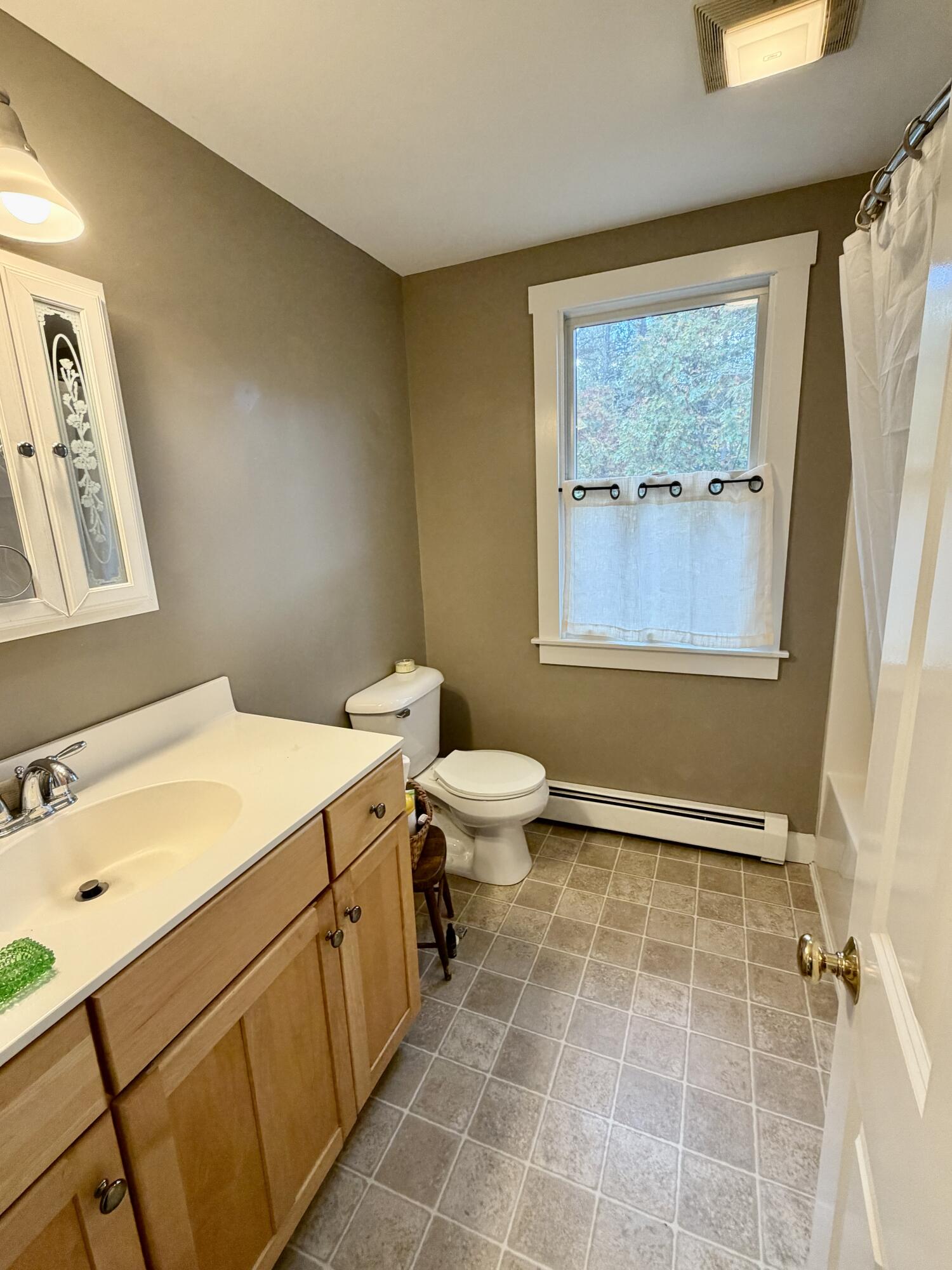 46 Spring Brook Road Wellfleet, MA 02667 - Photo 20 of 37 a bathroom with a sink a toilet and shower