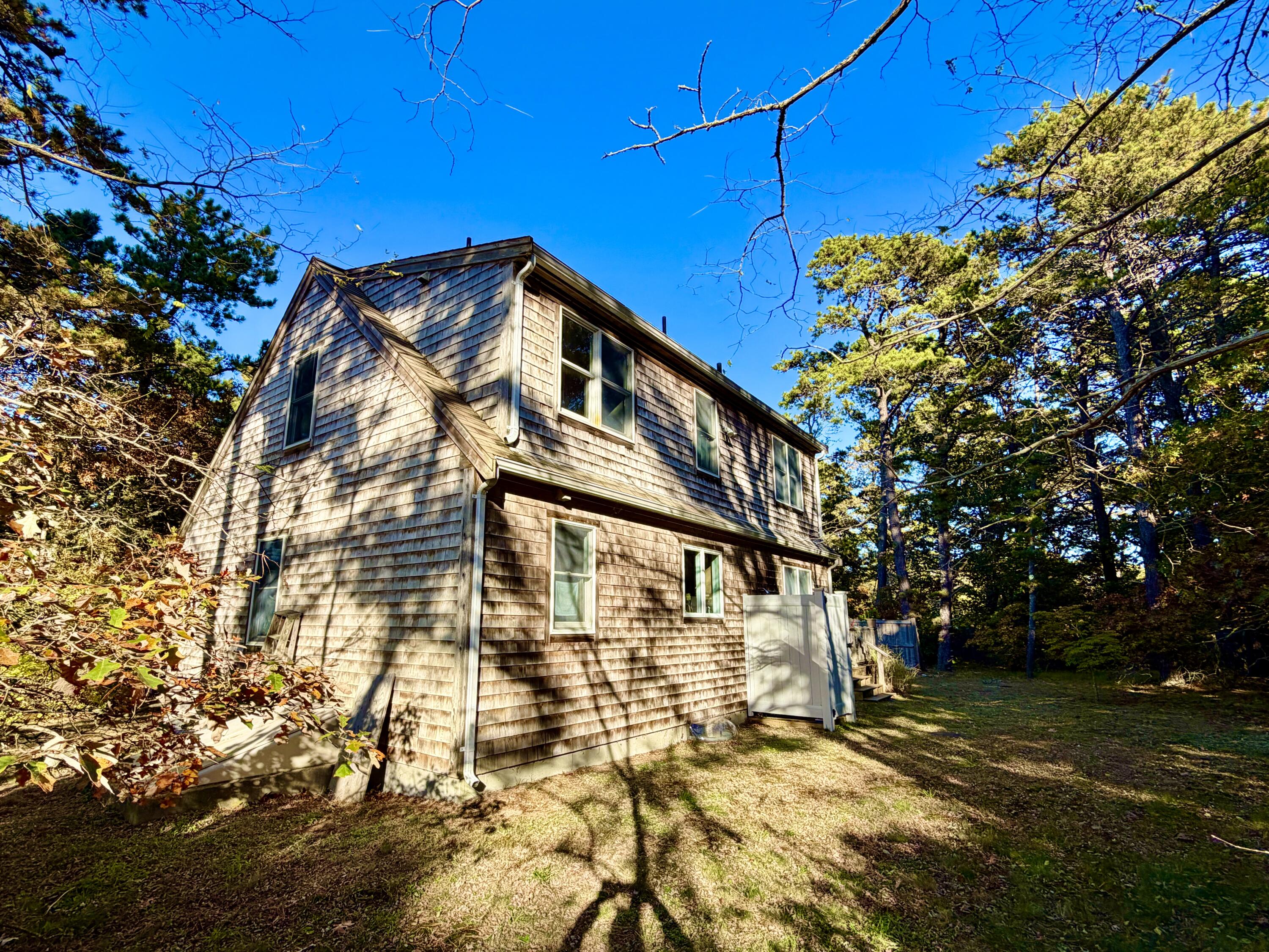 46 Spring Brook Road Wellfleet, MA 02667 - Photo 24 of 37 a view of a yard with plants