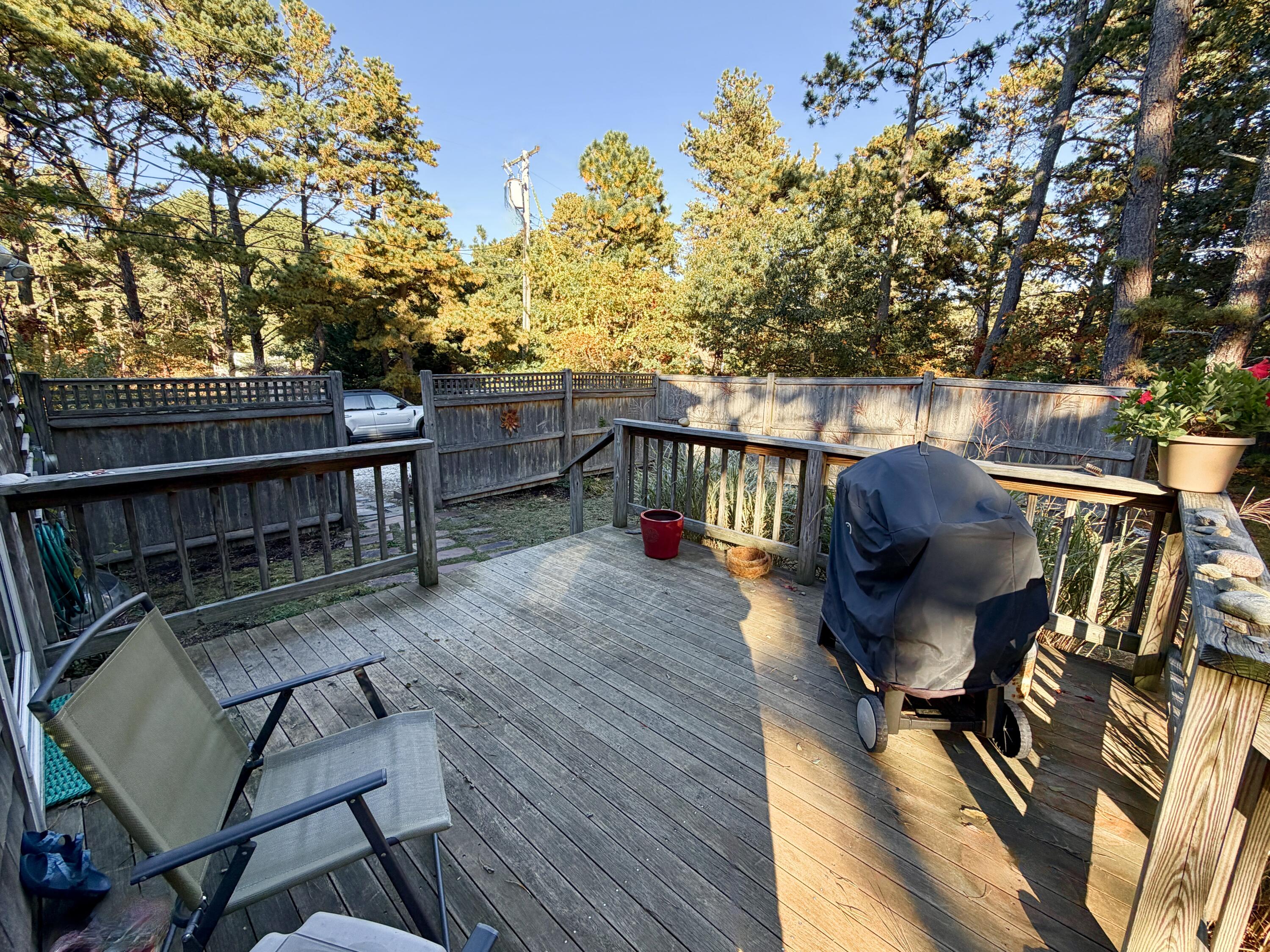 46 Spring Brook Road Wellfleet, MA 02667 - Photo 25 of 37 a view of a balcony with chairs