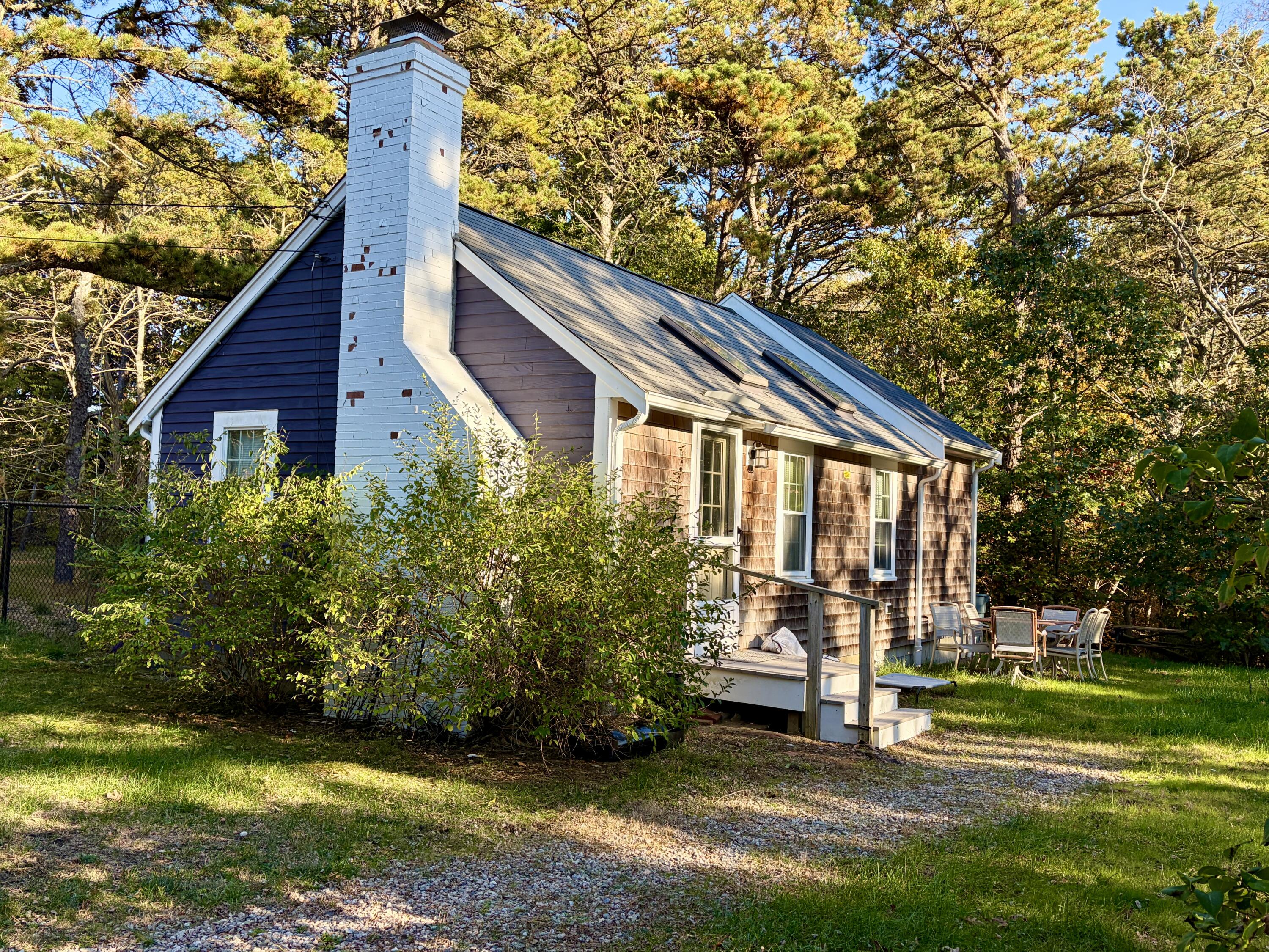 46 Spring Brook Road Wellfleet, MA 02667 - Photo 6 of 37 a view of a house with backyard and trees