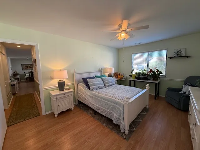 a bed room with a bed and a chandelier