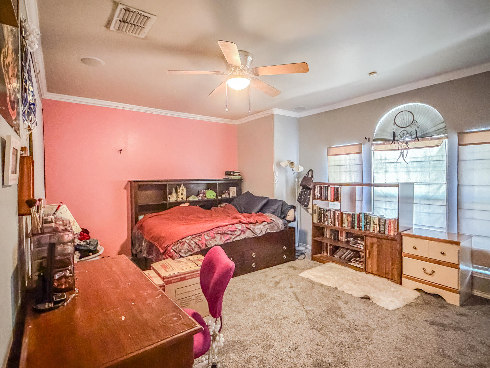 6715 91st Place Lubbock, TX 79424 - Photo 35 of 48 a bedroom with furniture and a large window