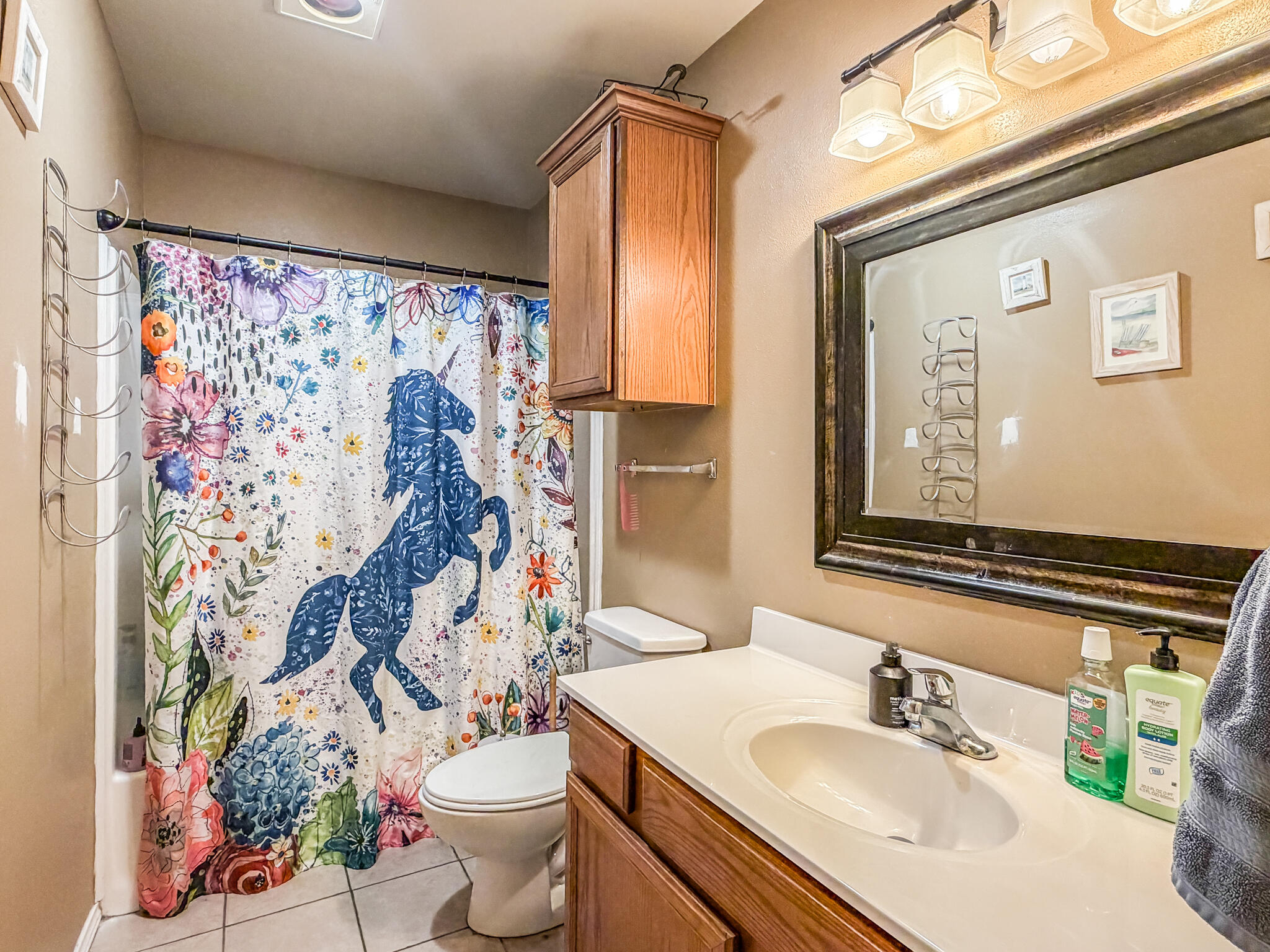 6715 91st Place Lubbock, TX 79424 - Photo 41 of 48 a bathroom with a sink toilet and shower