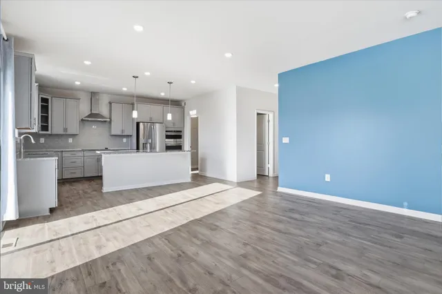 a view of a kitchen with wooden floor