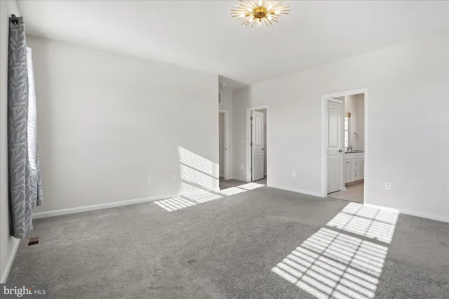 a bathroom with a granite countertop sink two mirror and a