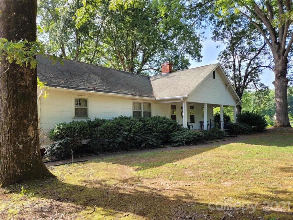 511 Flynn Road Rutherfordton, NC 28139 - Photo 2 of 32 a view of a house with swimming pool next to a yard