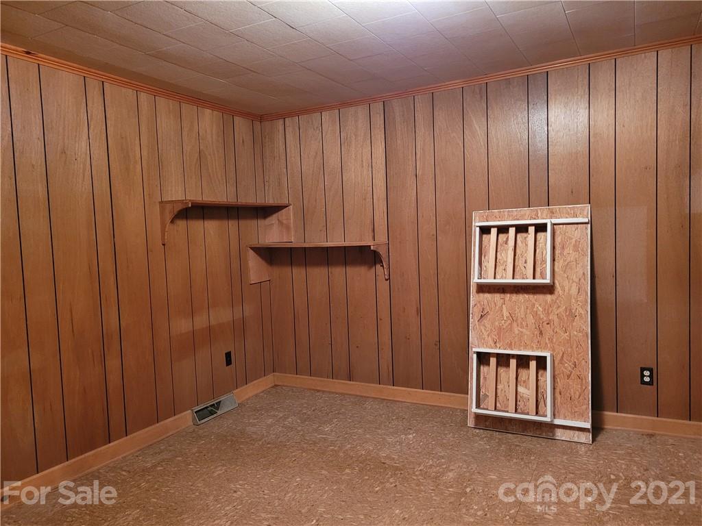 511 Flynn Road Rutherfordton, NC 28139 - Photo 13 of 32 an empty room with windows