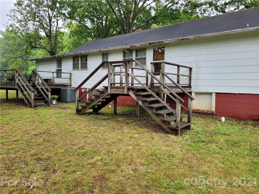 511 Flynn Road Rutherfordton, NC 28139 - Photo 23 of 32 a view of a house with a yard and wooden fence