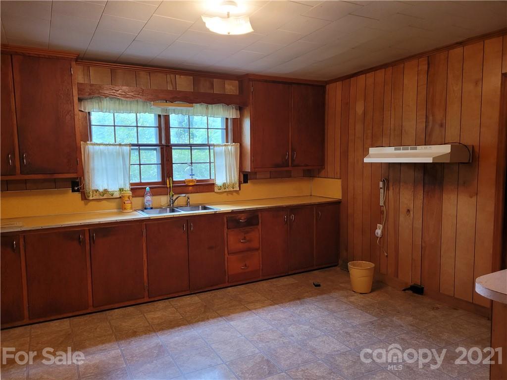 511 Flynn Road Rutherfordton, NC 28139 - Photo 8 of 32 a room with wooden walls and a sink